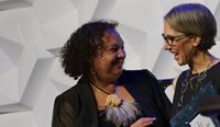 Dr Liza Robertson (right) receiving her award from RACGP Aboriginal and Torres Strait Islander Health Chair Dr Karen Nicholls at the GP25 awards ceremony. (Image: Jake Pinskier)
