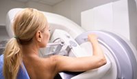 A female patient having a mammogram.