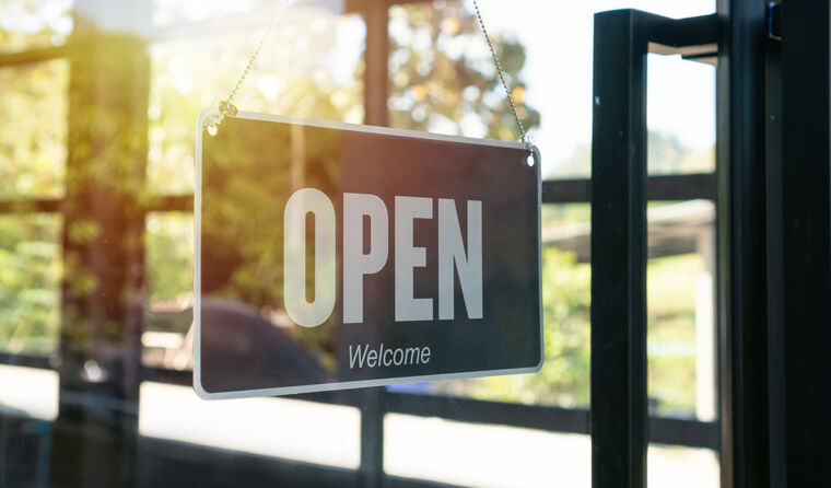 Clinic door with 'open' sign