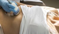 Person receiving abdominal ultrasound.