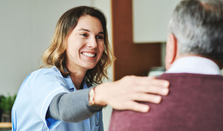 Doctor touching a patient's shoulder. 