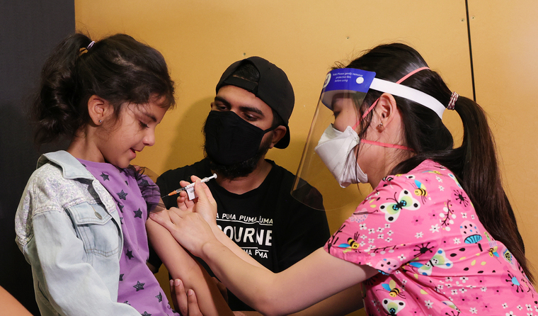 A young child being vaccinated.