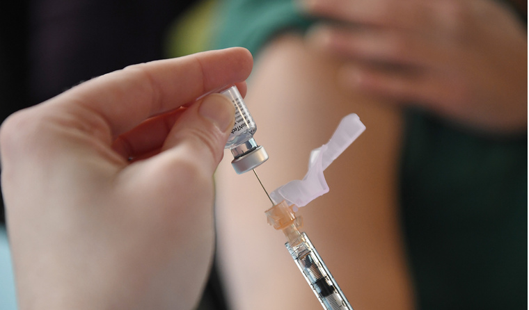 Young person receiving COVID vaccine