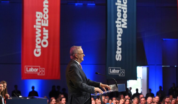 Australia's PM addresses a large audience.