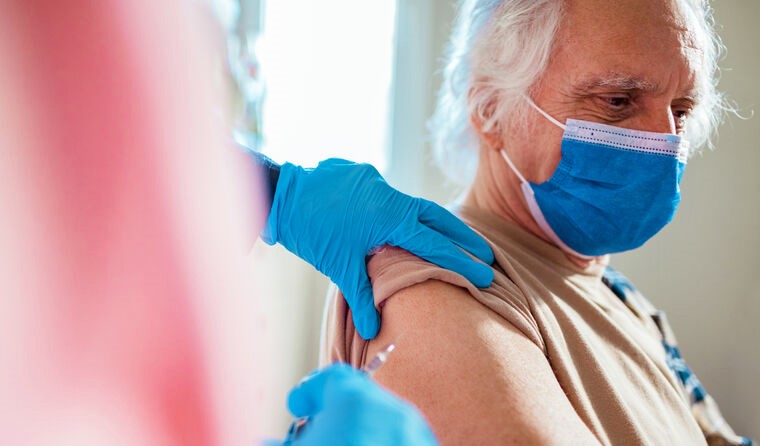 Older man receiving vaccination