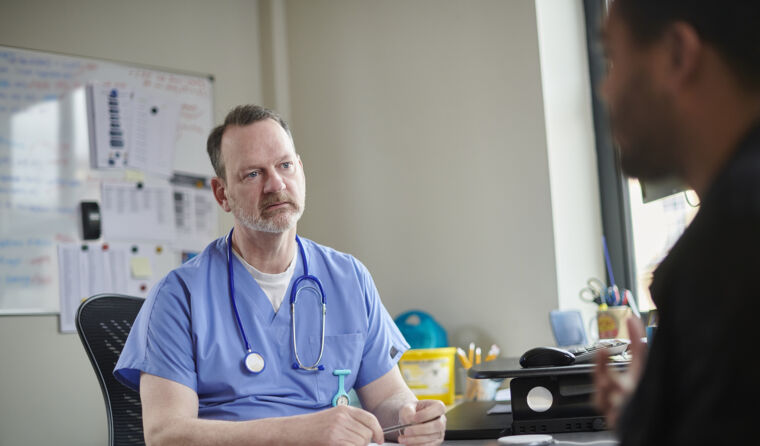 GP talking to patient.