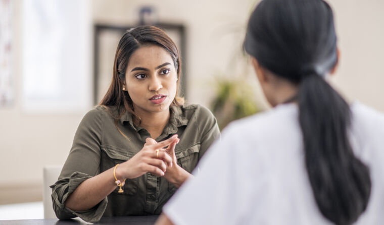 GP having serious discussion with patient