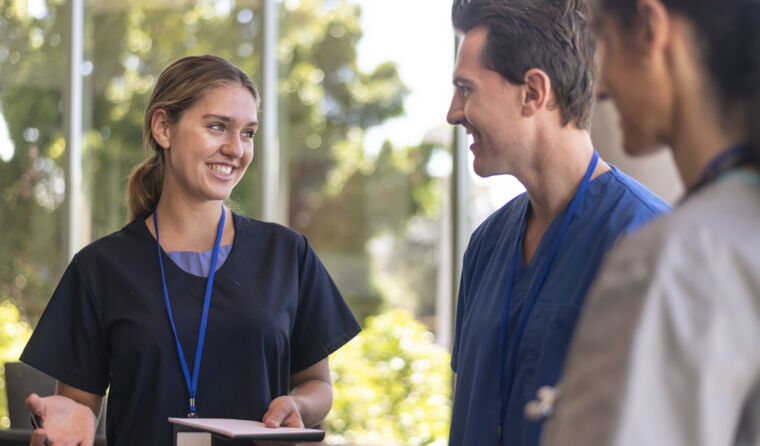 A group of trainee doctors talking.
