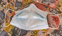 Surgical mask sitting on money