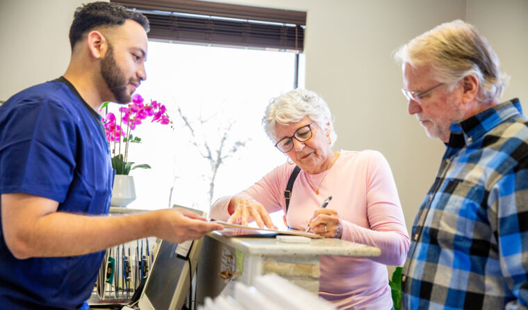 A patient paying for a medical service