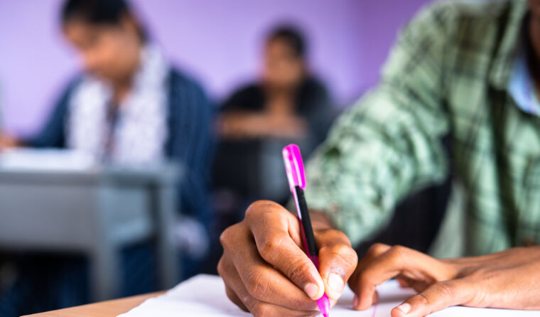 Close up of person sitting for written exam