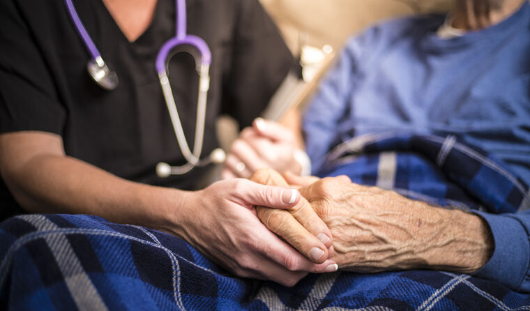 An elderly person with a doctor.