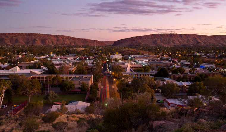 Wide shot of Alice Springs in the dark.