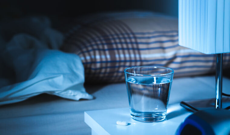 Sleeping pills on bedside table
