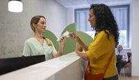 Person paying at the counter at doctors