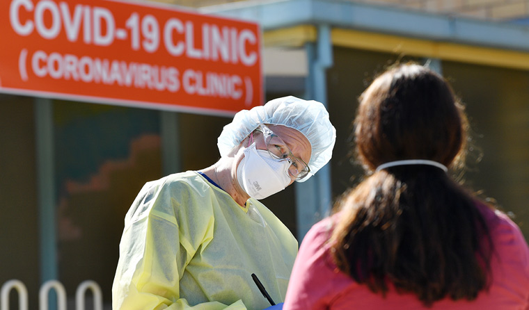 Doctor in PPE outside COVID clinic