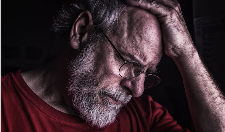 Older man looking stressed
