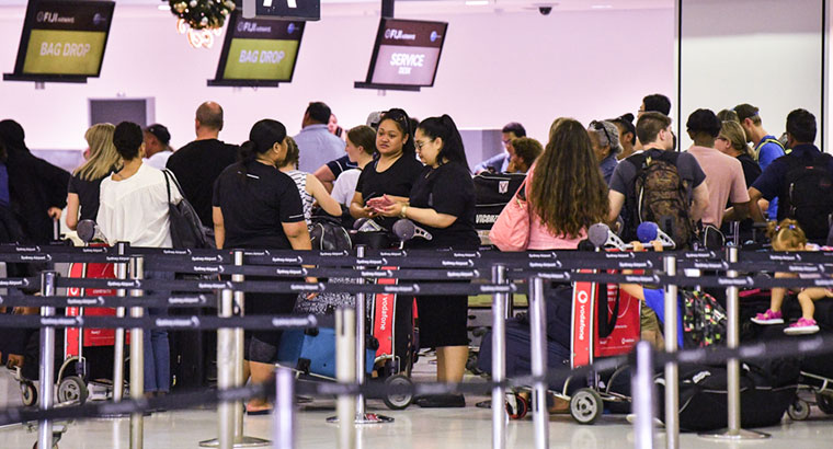The infected children arrived at the Sydney International Airport at 7.40 am on Friday 11 January. (Image: Brendan Esposito)