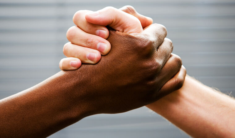 Black and white person shaking hands