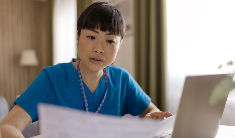 A doctor going through paperwork