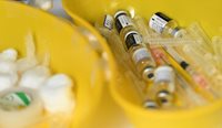 Vaccine vials and needles