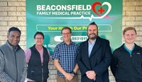 Beaconsfield Family Medical Practice owner Dr Prashanth Reddy and manager Darlene Lyall with Associate Professor Michael Clements, Dr Toby Gardner, and Judah Morris. (Image: Supplied)