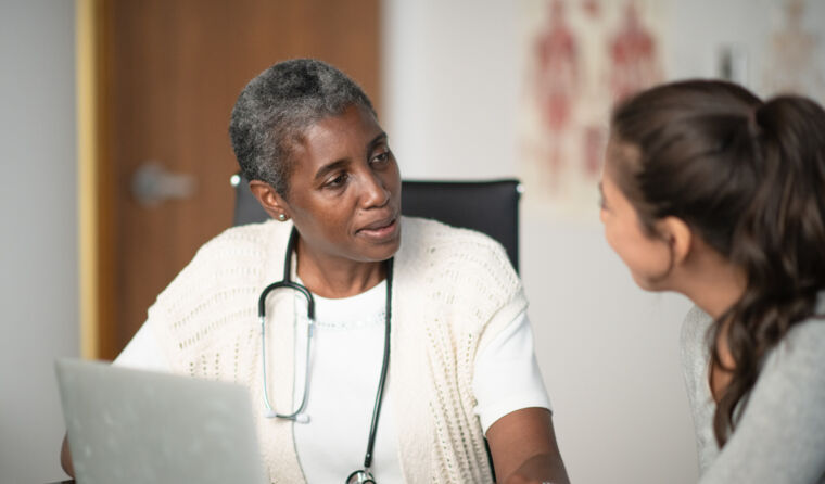 GP having serious discussion with patient