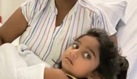 Three-year-old Tharnicaa Murugappan, who was recently transferred to Perth for urgent treatment of a suspected blood infection, and her mother Priya. (Image: AAP)