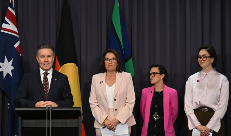 Mark Butler standing next to advocates