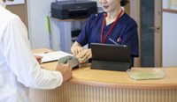Someone paying at a doctor