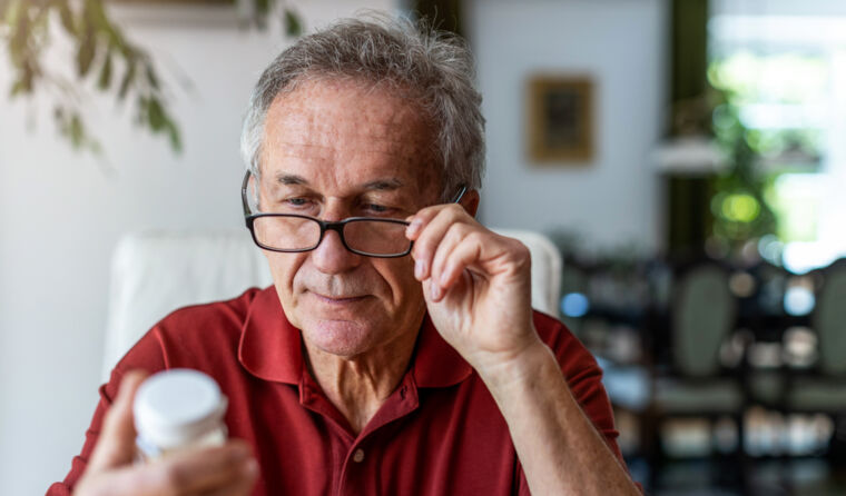 Man with bottle of pills.