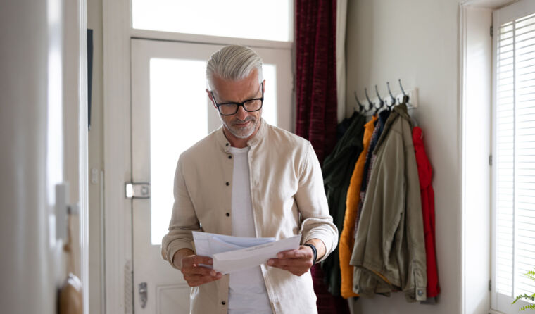 Man reading a letter.