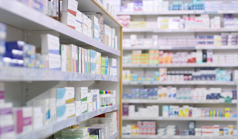 Pharmacy shelves filled with boxes of medication