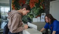Patients signing at doctor