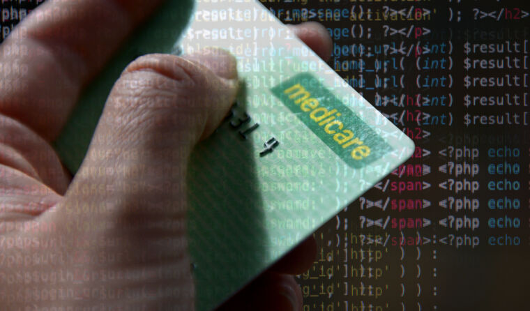Hand holding a Medicare card.