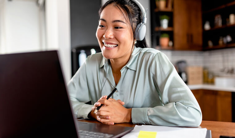 Young smiling woman sitting online exam