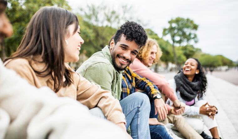 Group of people laughing together.
