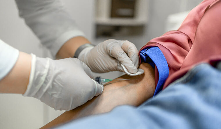 Close-up of male's arm getting blood test.