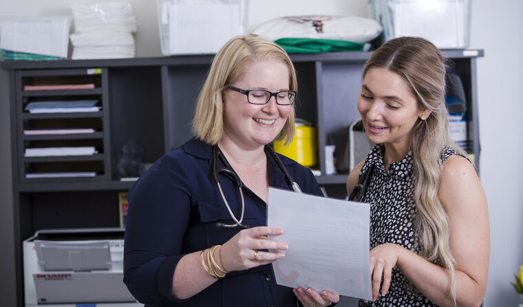 General practice registrar talking with supervisor