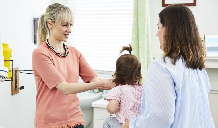 GP performing child's health check
