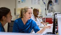 Healthcare professionals at a computer