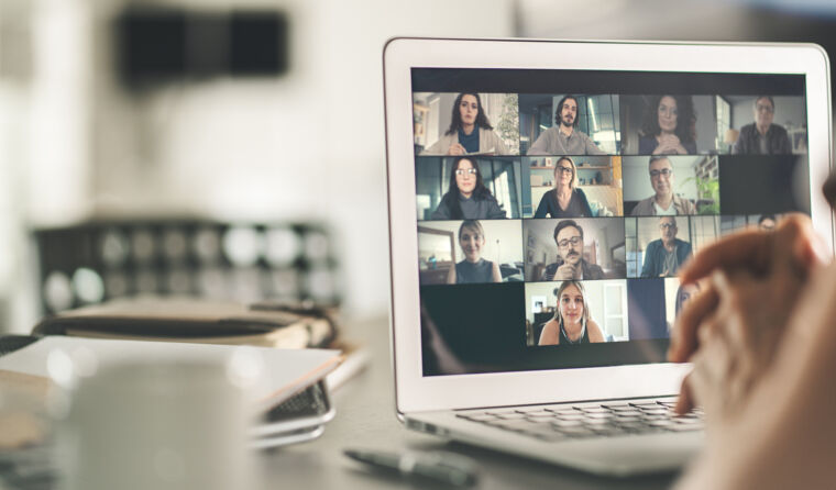 Person watching a webinar on a laptop.