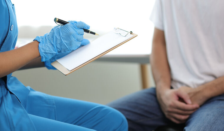 A patient and health professional talking