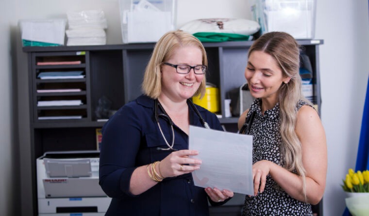 General practice registrar talking with supervisor