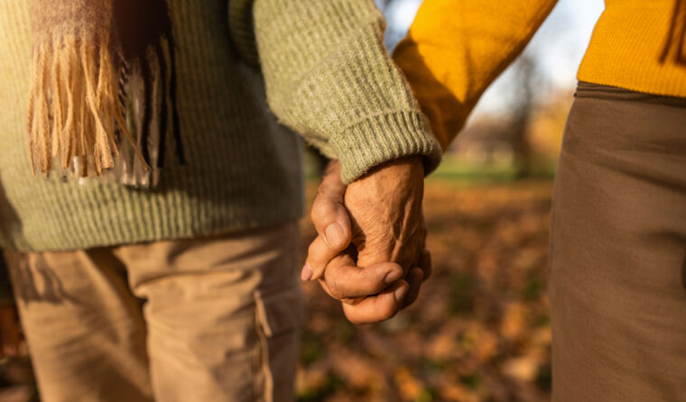 Older couple outside walking